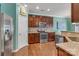 Kitchen with stainless steel appliances, granite countertops, and dark brown cabinets at 3159 Hartson Pointe Dr, Fort Mill, SC 29707