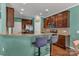 Kitchen with dark cabinets, granite counters, stainless steel appliances, and bar stool seating at 3159 Hartson Pointe Dr, Fort Mill, SC 29707
