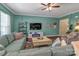 Comfortable living room featuring an entertainment center and teal colored walls at 3159 Hartson Pointe Dr, Fort Mill, SC 29707