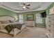 Spacious main bedroom with tray ceilings, complemented by generous windows, and a decorative ceiling fan at 3159 Hartson Pointe Dr, Fort Mill, SC 29707