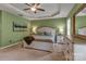 Inviting main bedroom featuring a tray ceiling, complemented by a large bed and matching dressers at 3159 Hartson Pointe Dr, Fort Mill, SC 29707