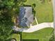 Aerial view of the home highlighting the roof, driveway, deck, and yard at 331 Elwood St, Kannapolis, NC 28081