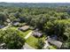An aerial view of a neighborhood nestled among lush green trees, showcasing the community at 331 Elwood St, Kannapolis, NC 28081