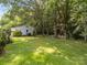 Backyard featuring a detached garage, mature trees and landscaping at 331 Elwood St, Kannapolis, NC 28081