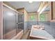 Bathroom features a shower and tub combination with a window above the sink at 331 Elwood St, Kannapolis, NC 28081
