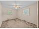 A simple bedroom featuring carpet, neutral walls, and two bright windows at 331 Elwood St, Kannapolis, NC 28081