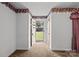 Neutral entryway showcasing carpet, white walls with decorative border, and a view of the front yard at 331 Elwood St, Kannapolis, NC 28081