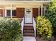 Charming front entrance with a white door and meticulously maintained landscaping at 331 Elwood St, Kannapolis, NC 28081