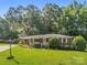 Charming red brick home featuring a lush front lawn and mature trees at 331 Elwood St, Kannapolis, NC 28081