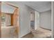 Hallway view with carpet, wood-paneled walls, and doorways leading to other rooms at 331 Elwood St, Kannapolis, NC 28081