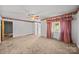 Neutral living room featuring carpet, white walls with decorative border, and a ceiling fan at 331 Elwood St, Kannapolis, NC 28081