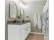 Well-lit bathroom featuring a double vanity with granite countertop and stylish black fixtures at 342 Battery Cir, Clover, SC 29710
