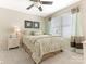 Cozy bedroom with a ceiling fan, two windows, and warm, neutral tones, ideal for relaxation at 342 Battery Cir, Clover, SC 29710