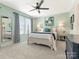 Airy bedroom featuring light green walls, soft carpeting, and plenty of natural light at 342 Battery Cir, Clover, SC 29710