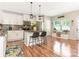 Open-concept kitchen featuring granite countertops, stainless steel appliances, and a breakfast bar at 342 Battery Cir, Clover, SC 29710