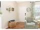 Cozy corner in living room with comfortable armchair, woven basket, and a stylish mirror at 342 Battery Cir, Clover, SC 29710