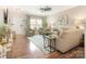 Spacious living room featuring hardwood floors, large windows, and comfortable, stylish furniture at 342 Battery Cir, Clover, SC 29710