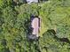 Aerial shot of the property showing the house surrounded by mature trees at 3701 Bounty Ct, Matthews, NC 28104