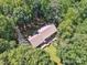 Aerial view of a wooded lot with a home, long driveway and wooden deck at 3701 Bounty Ct, Matthews, NC 28104