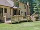 This backyard boasts a spacious, wooden deck and a beautiful brick chimney at 3701 Bounty Ct, Matthews, NC 28104