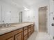 Large primary bathroom with double vanity, granite countertops, and a large mirror at 3701 Bounty Ct, Matthews, NC 28104