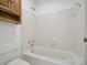 Bathroom featuring a tub-shower combo, ceramic tile, toilet and vanity at 3701 Bounty Ct, Matthews, NC 28104