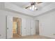 Bedroom featuring a ceiling fan, carpet flooring and ensuite bathroom at 3701 Bounty Ct, Matthews, NC 28104