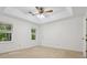 Bedroom featuring carpet flooring, a ceiling fan, large windows and trim at 3701 Bounty Ct, Matthews, NC 28104