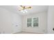 Bright bedroom with a ceiling fan, neutral carpet and a double door closet at 3701 Bounty Ct, Matthews, NC 28104