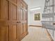 Spacious closet with wood doors, beige floors, shelving and trim at 3701 Bounty Ct, Matthews, NC 28104