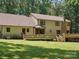 View of the house from the backyard featuring a large deck and bay window at 3701 Bounty Ct, Matthews, NC 28104