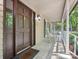 Close-up of the front door with sidelights, rocking chairs, and a well-maintained porch at 3701 Bounty Ct, Matthews, NC 28104