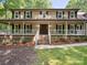 Inviting front porch with white railings, rocking chairs, and a classic entrance at 3701 Bounty Ct, Matthews, NC 28104