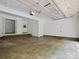 Spacious garage with stairs leading to interior and a door to backyard at 3701 Bounty Ct, Matthews, NC 28104