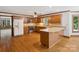 Traditional kitchen with wood cabinets, stainless steel appliances, and a breakfast bar for casual dining at 3701 Bounty Ct, Matthews, NC 28104