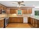 Well-equipped kitchen with stainless steel appliances, wood cabinets, and a window over the sink at 3701 Bounty Ct, Matthews, NC 28104