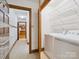 Laundry room with tile floors, laundry machines and shelving for storage at 3701 Bounty Ct, Matthews, NC 28104