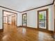 Spacious living room with hardwood floors and scenic views through large windows at 3701 Bounty Ct, Matthews, NC 28104