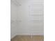 Walk-in closet featuring shelving and carpet flooring at 3701 Bounty Ct, Matthews, NC 28104