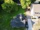 Aerial view of a home with a spacious backyard, mature trees, and private driveway at 409 W Norment Ave, Gastonia, NC 28052