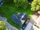 Aerial view of a house with a large yard, lush landscaping, and a driveway with 3 vehicles at 409 W Norment Ave, Gastonia, NC 28052