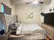 Comfortable bedroom featuring a luxurious upholstered headboard and a coordinated bedding set at 409 W Norment Ave, Gastonia, NC 28052