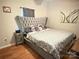 Comfortable bedroom featuring a luxurious upholstered headboard and a coordinated bedding set at 409 W Norment Ave, Gastonia, NC 28052