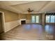 Spacious living room has a cozy fireplace and hardwood style floors at 417 Garret Ln, York, SC 29745