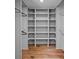 Walk-in closet with ample shelving and storage for clothes and accessories at 4209 Windwood Cir, Charlotte, NC 28226