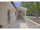 Charming covered porch with comfortable seating, perfect for enjoying the outdoors while shielded from the elements at 4209 Windwood Cir, Charlotte, NC 28226