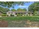Charming single-story home with a well-manicured lawn and tasteful landscaping at 4209 Windwood Cir, Charlotte, NC 28226