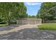 Attached garage with three bays and a wide driveway offering ample parking space at 4209 Windwood Cir, Charlotte, NC 28226
