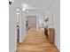 Hallway with hardwood floors, a modern console table, and access to other rooms at 4209 Windwood Cir, Charlotte, NC 28226