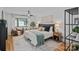 Bright main bedroom with decorative rug, modern ceiling fan, and comfortable seating area at 4209 Windwood Cir, Charlotte, NC 28226